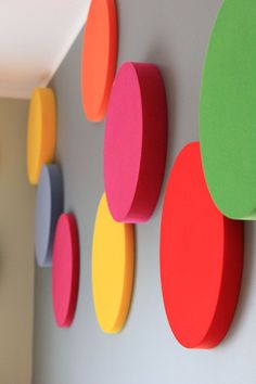 colorful circles are hanging on the wall