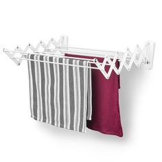 two towels hanging on a clothes line with one red and the other grey striped towel