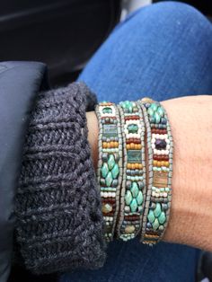 a close up of a person wearing bracelets