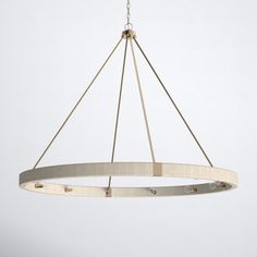 a circular light fixture hanging from a ceiling