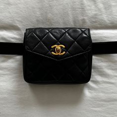 Vintage Chanel Belt Bag Crafted In Black Lambskin Leather With Signature Diamond Quilting, Featuring Original 24k Gold-Plated 'Cc' Turn-Lock On Envelope Front Flap. Belt Fits Sizes Xs-M. Can Be Switched Out For Other Belts Or Worn Across The Chest Pristine Condition Original Belt Included. Dust Bag Included. Features: Adjustable Leather Waist Strap With Buckle 'Cc' Turn-Lock Closure On Pouch Interior Zip Pocket Lambskin Leather Leather Lining Gold Hardware Details: Length: 5.5" (13 Cm) Height: 4 Luxury Pouch-shaped Belt Bag, Luxury Belt Bag Pouch, Luxury Rectangular Belt Bag With Removable Pouch, Luxury Black Rectangular Belt Bag, Luxury Black Pouch Belt Bag, Designer Rectangular Formal Belt Bag, Designer Formal Rectangular Belt Bag, Luxury Rectangular Belt Bag For Evening, Luxury Belt Bag With Gold-tone Hardware