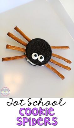 a spider made out of cookies on top of a white surface with the words, hot school cookie spiders