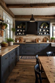 a kitchen with wooden floors and black cabinets, wood flooring and open shelving