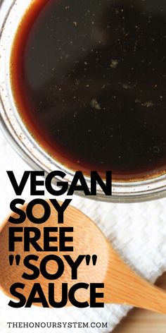 a bowl of soy sauce with a wooden spoon next to it and the words vegan soy free i soy sauce