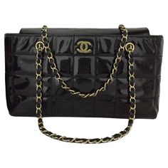 Classic Chanel Black Enamel Shoulder Bag. Leather Chicklet Design. Vintage Chanel with gold color accents. CC in the front of the bag. Leather and gold straps. The interior of the bag is leather and has separating compartments. The interior has a wonderful CC print fabric. The interior has a leather badge that has Chanel Italy Imprinted/Stamped on the leather. This bag measures approx. - 12.75w x 7h x 3.5d This bag measures approx. - 12.75w x 7h x 3.5d No box is included in this listing. Pink Chanel Flap, Vintage Chanel Bag, Chanel Boutique, Classic Chanel, Classic Flap Bag, Chanel Collection, Color Accents, Pink Chanel, Pink Handbags