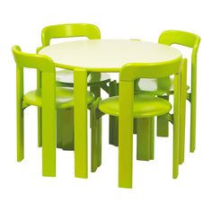 a white table with four green chairs and a round dining table on top of it