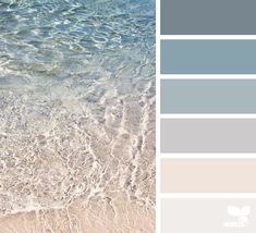 the color scheme is blue, gray and white with waves coming in from the ocean