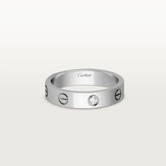 Cartier - LOVE wedding band, 1 diamond - Ring White gold/Diamond - LOVE wedding band, 18K white gold (750/1000), set with 1 brilliant-cut diamond totaling 0.02 carats. Width: 4 mm (for size 52). Please note that the carat weight, number of stones and product dimensions will vary based on the size of the creation you order. For detailed information please contact us. Cartier White Diamond Ring With Accents, Cartier Diamond White Ring With Diamond Accents, White Cartier Diamond Ring With Accents, Cartier Rings Diamond White With Diamond Accents, Cartier Rings With Diamond Accents In Diamond White, Cartier Single Diamond Round Cut Jewelry, Cartier Jewelry With Single Round Cut Diamond, Cartier Diamond Promise Jewelry, Cartier Silver Rings With Diamond Accents