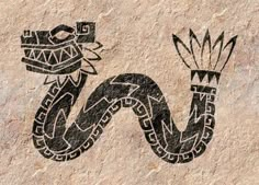 a black and white drawing of a snake on a stone wall with an ornament in the middle