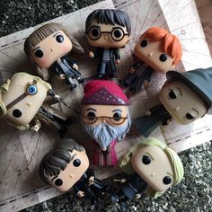 several harry potter action figures are arranged in a circle on top of a piece of paper