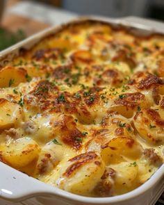 a casserole dish with potatoes and cheese