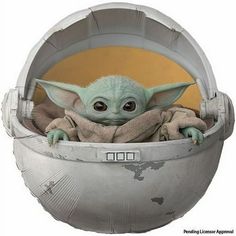 the child yoda is sitting in a metal container