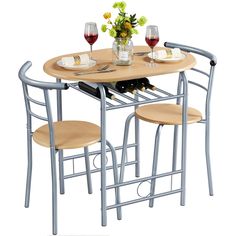 PRICES MAY VARY. 【Modern Look】This 3-piece dining set features classic curved silhouettes for a casual and inviting look. The steel slat frame has a stylish restaurant style, which reflects your unique taste. The wood-like grain adds a natural accent and balances the coolness of metal. 【Designed for Small Spaces】Measuring 31.5’’ L x 21’’ W, the oval tabletop is large enough for 1-2 people to dine, read or have a close chat cozily. The chairs perfectly fit the curving edges of the table, allowing Cozy Kitchen Nook, Round Dining Table Set, Built In Wine Rack, Compact Table And Chairs, Bistro Table Set, Round Dining Table Modern, Round Dining Table Sets, Small Kitchen Tables, Kitchen Table Chairs