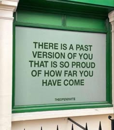 a sign on the side of a building that says there is a past version of you that is so proud of how far you have come