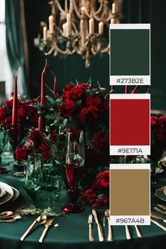 the table is set with red roses and candles, green napkins, silverware, and wine glasses