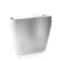 an unusual white bathtub with three toothbrushes in it's sidewall