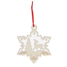 an ornament shaped like a snowflake with a wolf on the front