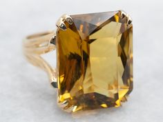 Get ready to make a statement with this ring! Crafted with stunning yellow gold and a sparkling emerald cut citrine stone, this cocktail ring will add a touch of brilliance to any outfit. Perfect for special occasions or just to add some flair to your everyday look.Metal: 10K Yellow GoldGem: Citrine 15.61 CaratsGem Measurements: 14.3 x 17.7 mm, Emerald CutRing Size: 6Marks: "10K-PS" Stamped on the inside band Yellow Citrine Ring, Right Hand Ring, Split Shank Ring, Emerald Cut Rings, Right Hand Rings, Hand Ring, Yellow Citrine, Citrine Ring, Citrine Stone