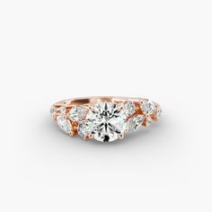 a rose gold engagement ring with three stones