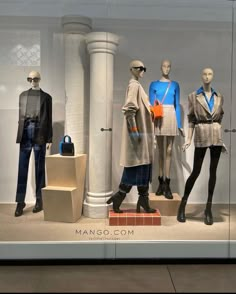 mannequins dressed in fashionable clothing on display