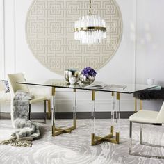 an elegant dining room with white and gold decor