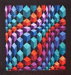 a quilted wall hanging with an abstract design in purple, orange and blue colors