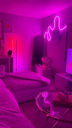 a living room filled with furniture and neon lights