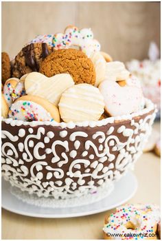 a bowl filled with cookies and other treats