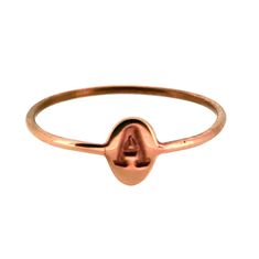 18ct Rose Gold Vermeil signet ring. Our gold vermeil is 18ct rose gold plated sterling silver. The signet ring is a classic design. Adorning the pinky finger of Royals and the aristocracy for centuries. A certain Princess was seen wearing one on her ring finger and all of a sudden they became cool again.  This tiny version is perfect for ladies and princesses. Hand crafted from 18ct rose gold plated sterling silver in our London studio & workshop. A small 6x4mm oval. Hand stamped with the letter A in Typewriter font . Set on a 1mm wide halo band  6x4mm Oval signet ring 1mm halo band Hand stamped Typewriter font A 18ct rose gold vermeil marked 925 for sterling silver Supplied in gift pouch, perfect for storing rings in. Halo Band, Pinky Finger, Her Ring, Letter A, Gorgeous Gift, Ring Finger, Typewriter, Signet Ring, Gold Plated Sterling Silver