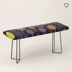 a black bench with colorful designs on it