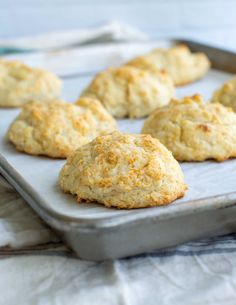 biscuits on a baking sheet ready to go into the oven or baked in the oven