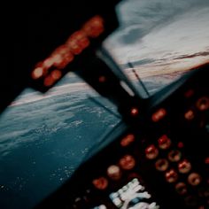 the view from inside an airplane looking out at earth