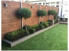 a wooden fence with some trees in it