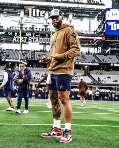 a man standing on top of a football field