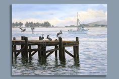 some birds are sitting on the end of a dock by the water with a boat in the background