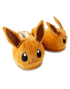 a pair of pokemon slippers with pikachu's eyes and ears on them