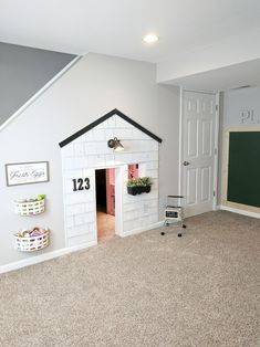 there is a dog house built into the wall in this room with no one inside