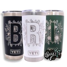 three yeti tumblers with the letter b and floral designs on them are shown