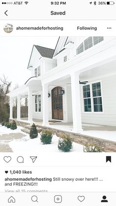 a white house with snow on the ground and trees in front of it, taken from an instagram