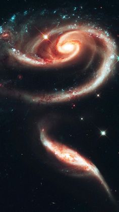 two spiral galaxy like objects in the sky