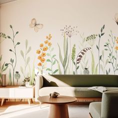 a living room with flowers and butterflies painted on the wall