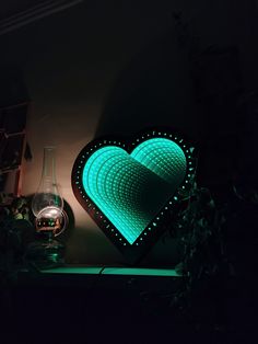 a heart shaped light sitting on top of a table