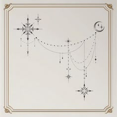 a white and gold framed wall with stars, moon and snowflakes on it