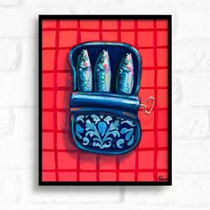 a painting of fish in a blue case on a red and white checkered wall