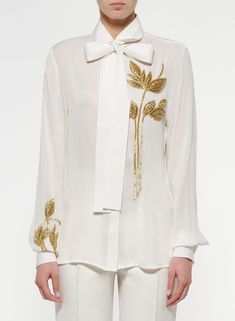 Elevate your elegance with our Women's White Classic Shirt, featuring intricate handwork and gold motifs. Perfect for weddings, bridesmaids, or formal dinner parties, this shirt is a timeless blend of sophistication and style. A thoughtful gift for her that adds a touch of glamour to any occasion. Make a statement in classic white with a touch of gold workshop now for refined grace!  Welcome to THE MAGNUS ATELIER on Etsy! We want to ensure your shopping experience is delightful and transparent. Please take a moment to review our shop policies before purchasing: 1. Processing Time: Each item is carefully crafted and made to order. Please check the individual product listing for the estimated processing time. For custom-made orders, the processing time may take up to 2-4 weeks, and for the r Luxury Traditional Shirt With Floral Embroidery, Luxury Elegant Blouse With Intricate Embroidery, Luxury White Blouse With Intricate Embroidery, Luxury Designer Shirt For Festive Season, Luxury White Festive Blouse, Luxury Elegant Patterned Shirt, Luxury Shirt For Wedding, Luxury White Tops With Resham Embroidery, Luxury Casual Embroidered Shirt