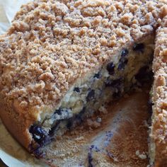 a blueberry crumb cake is cut in half