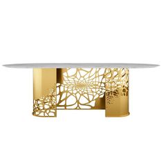 a white and gold dining table with an intricate design on the top, in front of a white background