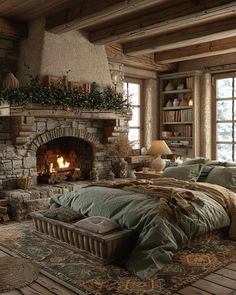 a bedroom with a stone fireplace and bed in it's center surrounded by wooden flooring