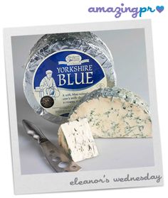 blue cheese is shown with a knife next to it and the words yorkshire blue written in white