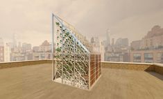 a glass house with plants growing in it on top of a roof over looking the city